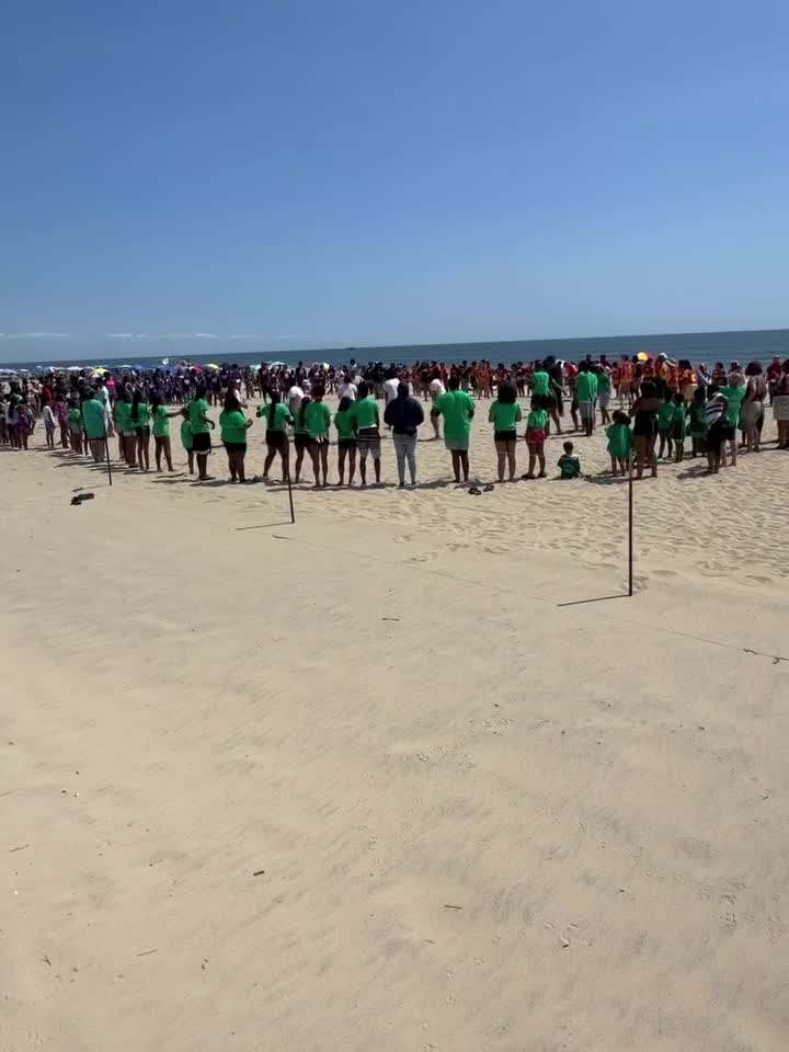 Giant Harambee on the Beach